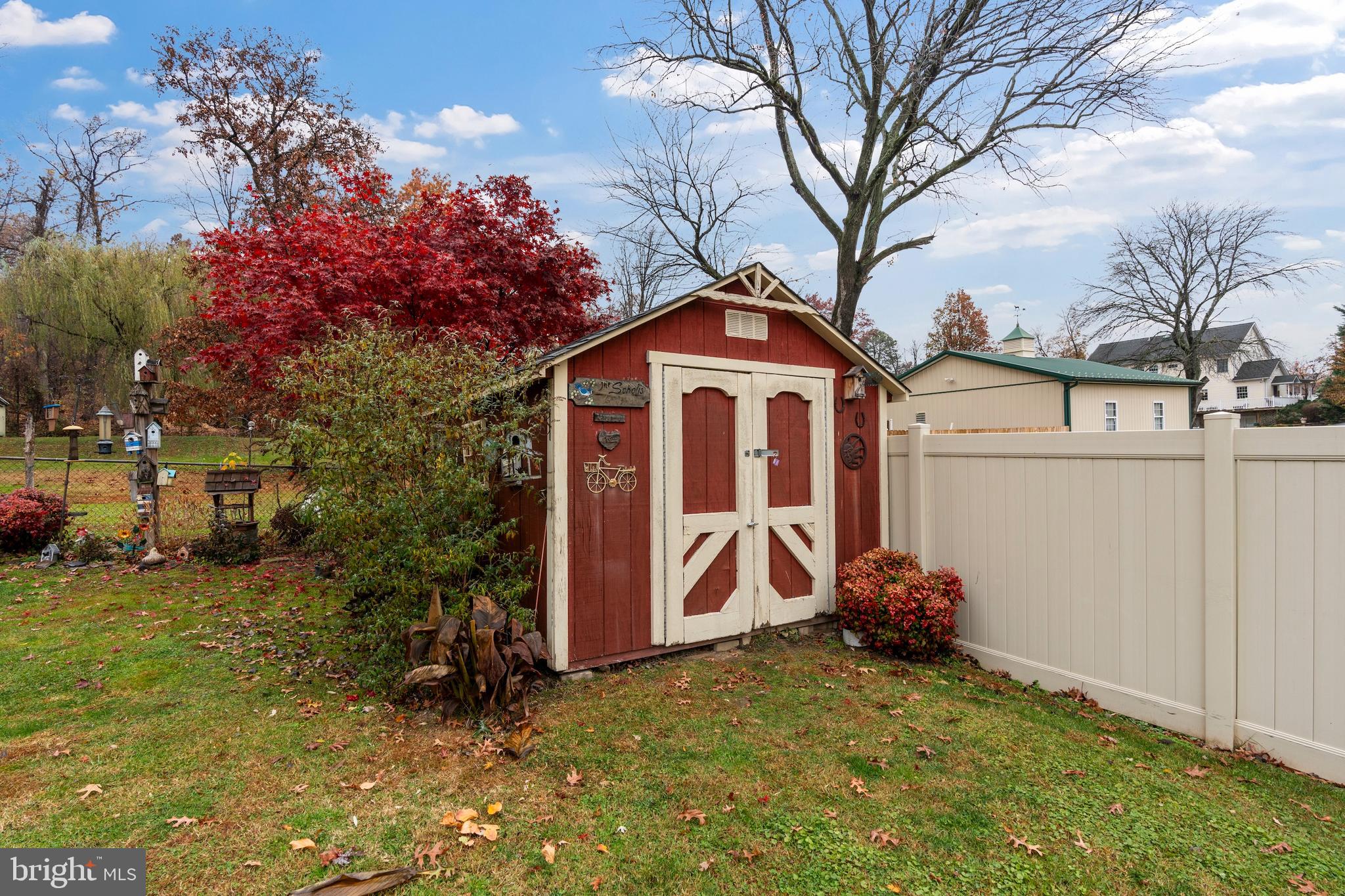 14 Stable Gate Court Perry Hall, MD 21128 - Photo 35 of 46 a view of a house with a large tree and a yard