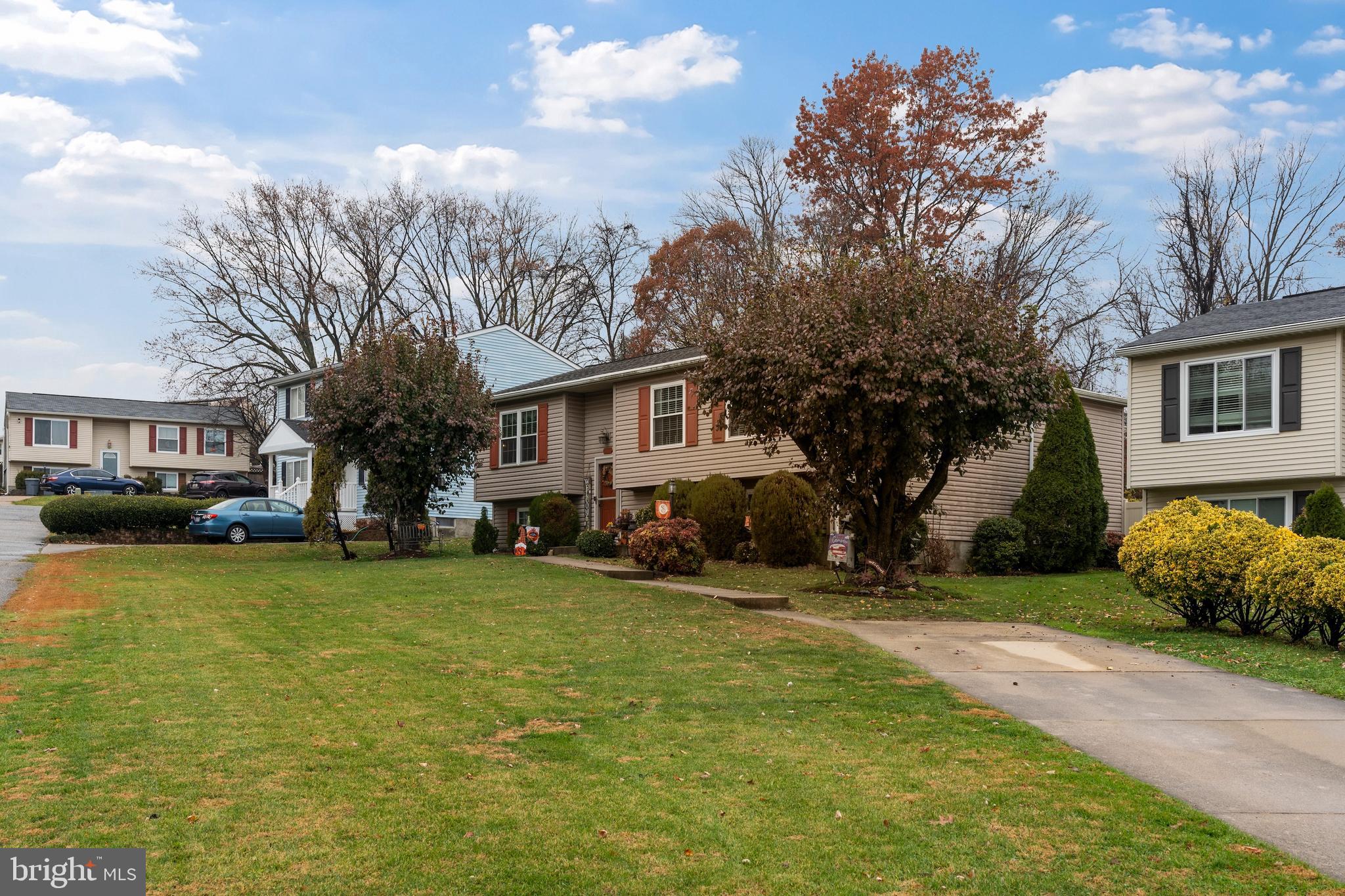 14 Stable Gate Court Perry Hall, MD 21128 - Photo 40 of 46 a front view of a house with a garden and trees