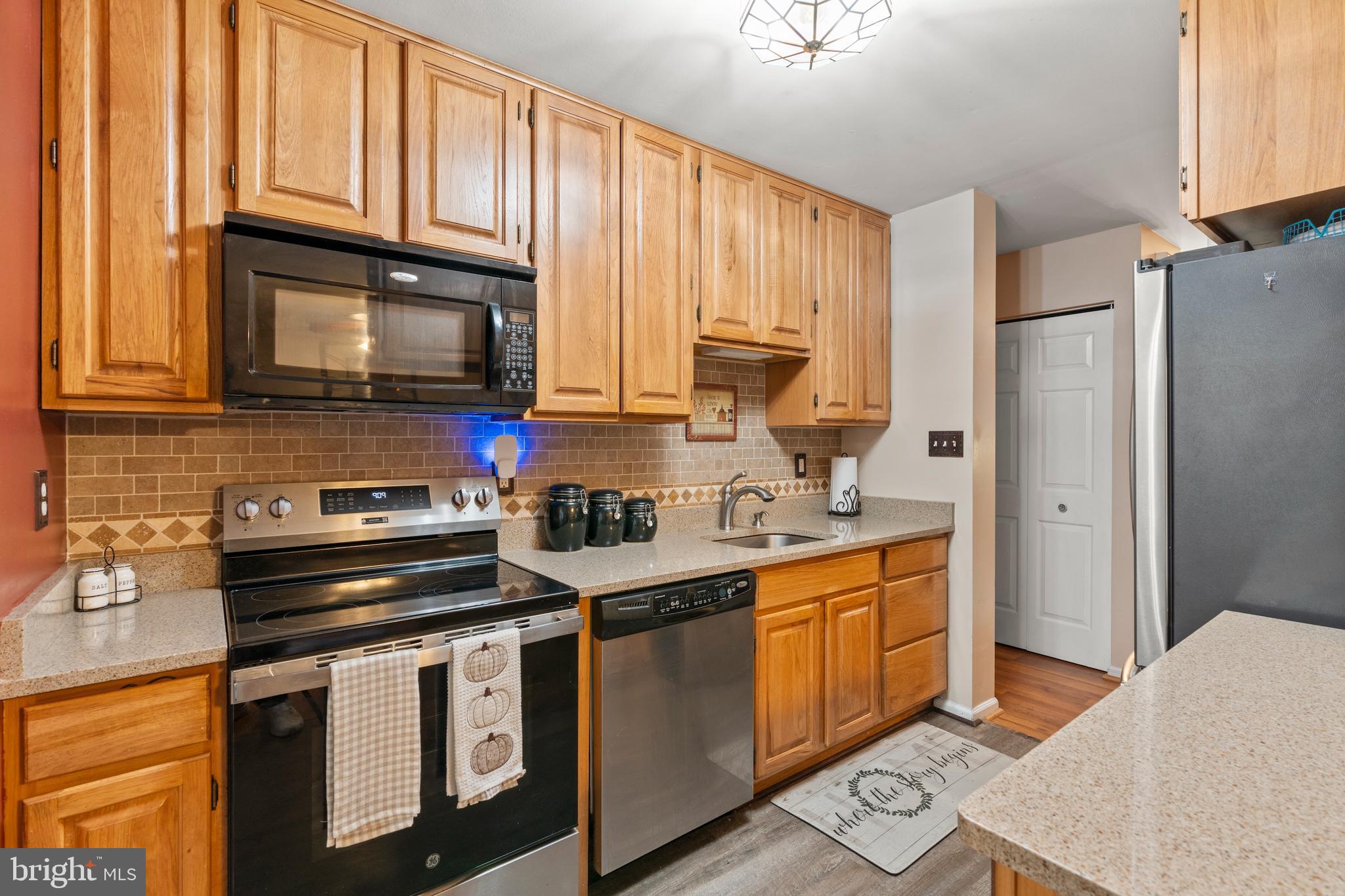 14 Stable Gate Court Perry Hall, MD 21128 - Photo 6 of 46 a kitchen with stainless steel appliances granite countertop a stove a sink dishwasher and a refrigerator