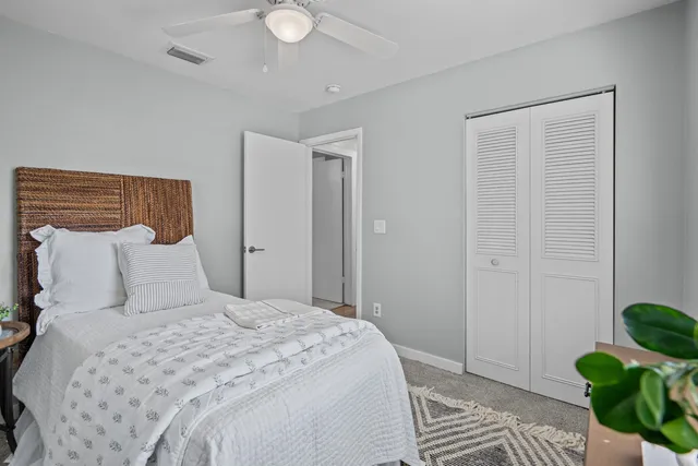 a bedroom with a bed and closet