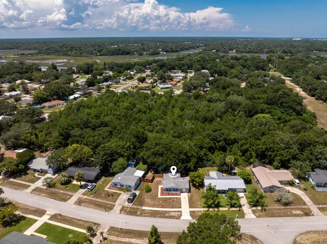 an aerial view of residential houses with outdoor space