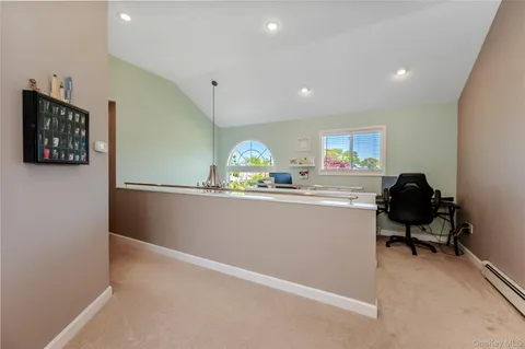 a room with a chair and gym equipment