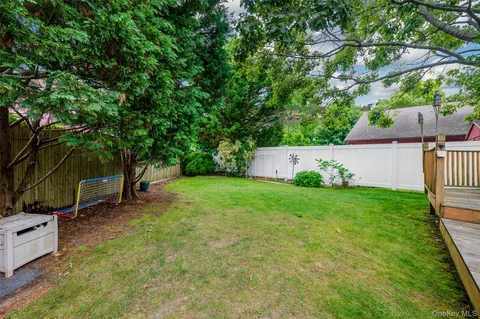 a view of a backyard with a table and chair