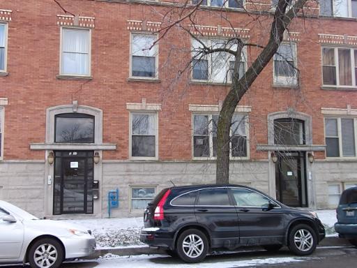 2839 West Cortez Street, Unit 1 Chicago, IL 60622 - Photo 1 of 1 a car parked in front of a brick building