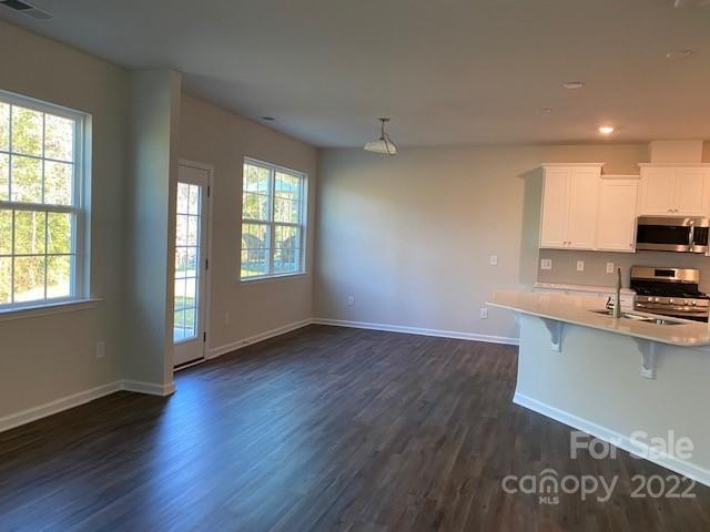 6550 Gopher Road, Unit 331 Lancaster, SC 29720 - Photo 3 of 12 wooden floor in an empty room with a window
