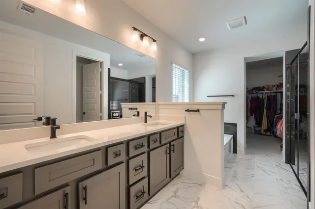 a bathroom with a bathtub and a shower
