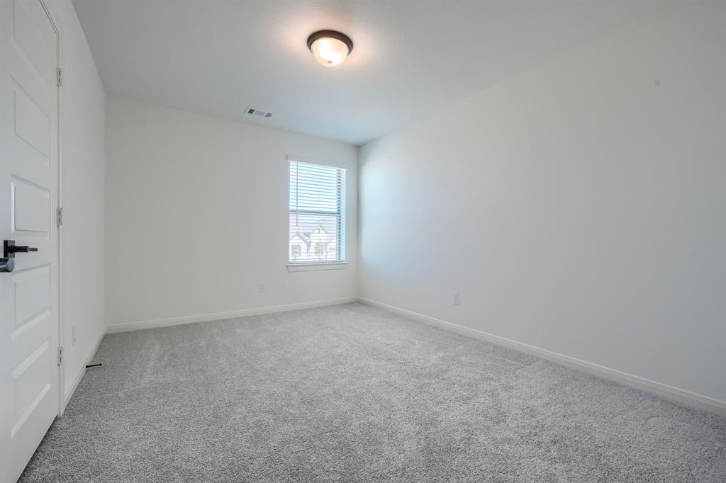 1348 Bay Laurel Road Fate, TX 75087 - Photo 21 of 27 an empty room with windows