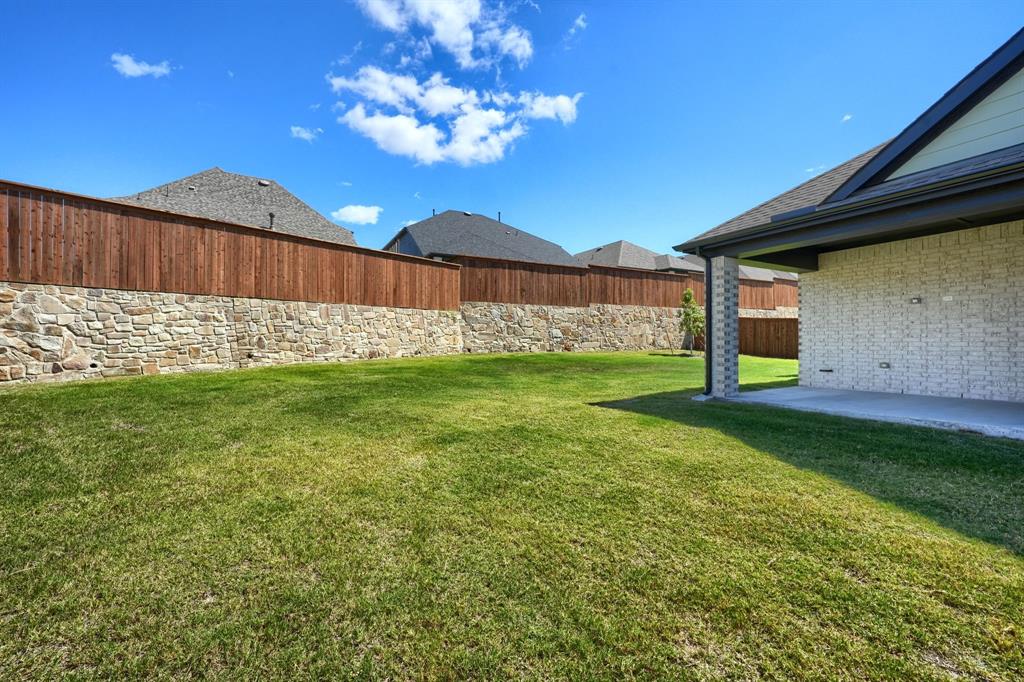 1348 Bay Laurel Road Fate, TX 75087 - Photo 25 of 27 a view of a backyard with a garden