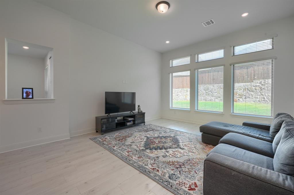 1348 Bay Laurel Road Fate, TX 75087 - Photo 10 of 27 a living room with furniture and a flat screen tv