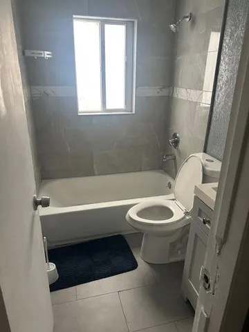 a bathroom with a sink a toilet and a bathtub