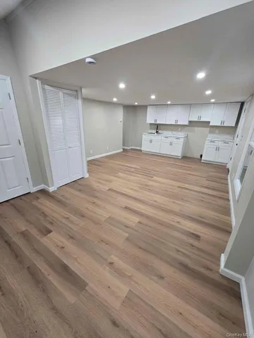 a view of kitchen and empty room