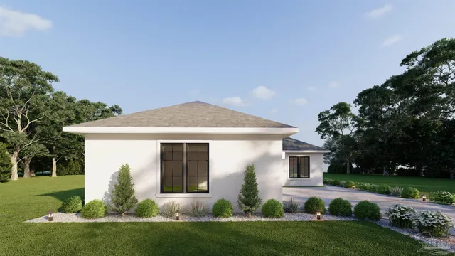 a front view of house with a garden