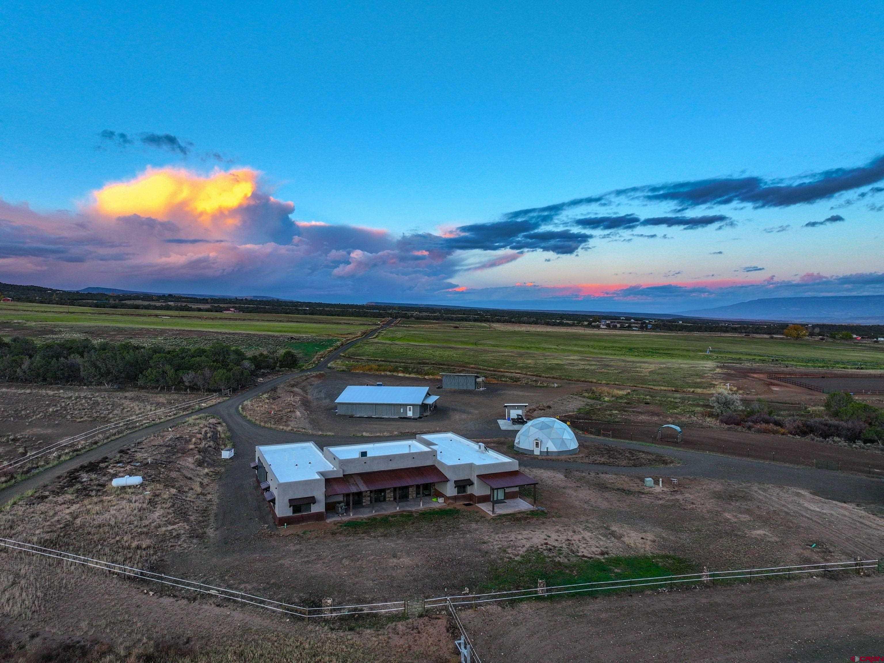 a view of a bench in middle of the field