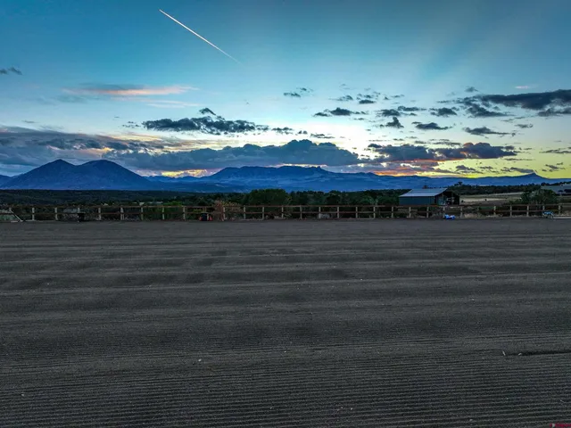 a view of water heater room with wooden floor