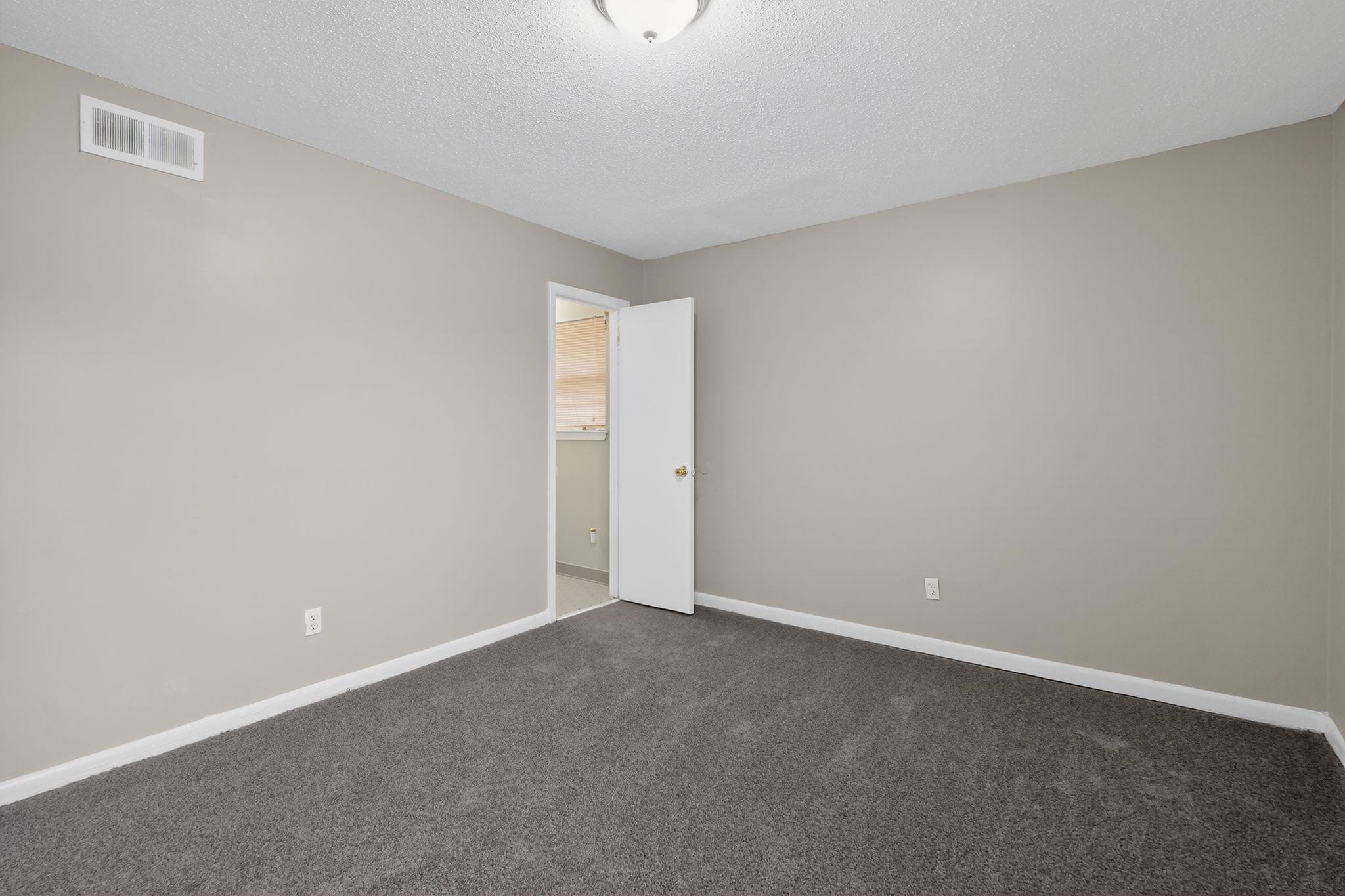 4566 Weaver Road Memphis, TN 38109 - Photo 20 of 32 a view of an empty room and window