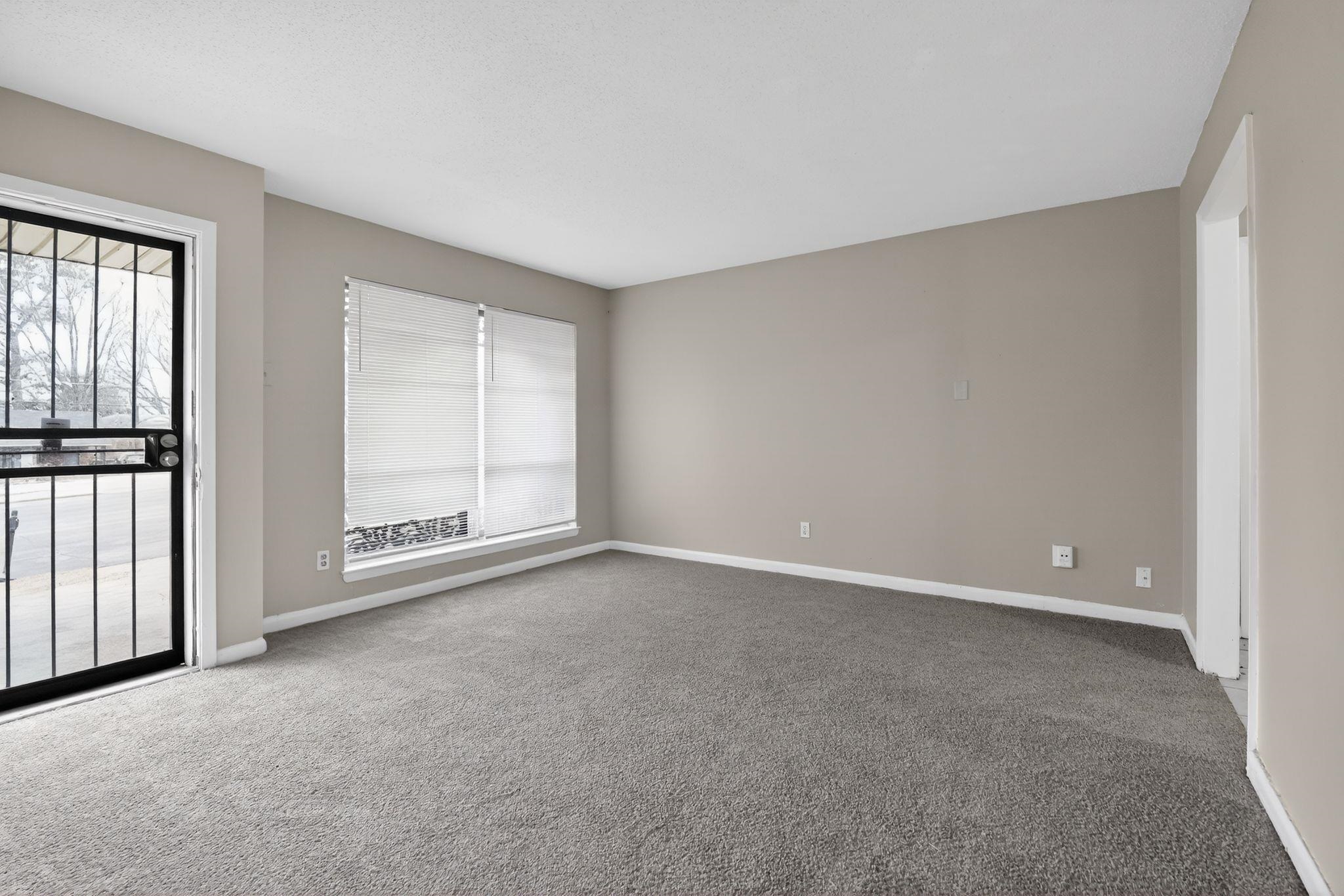 4566 Weaver Road Memphis, TN 38109 - Photo 4 of 32 a view of an empty room with a window