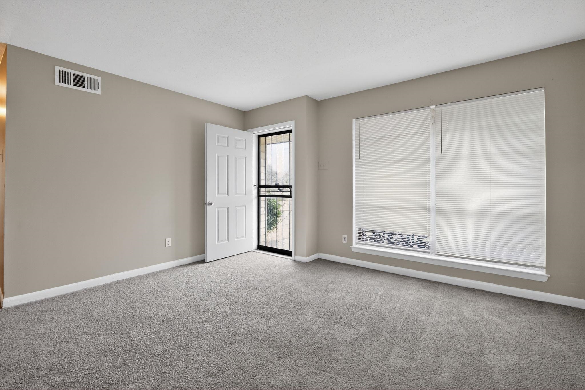 4566 Weaver Road Memphis, TN 38109 - Photo 5 of 32 a view of an empty room with a window