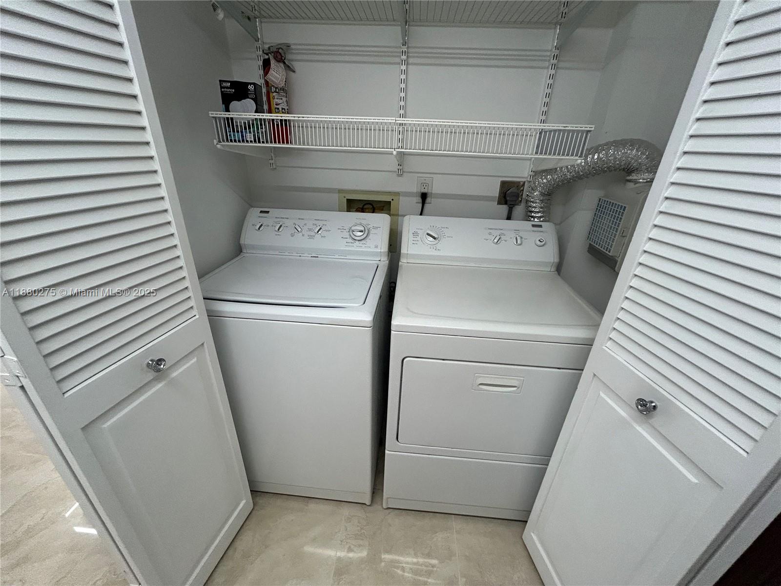 251 Crandon Boulevard, Unit 424 Key Biscayne, FL 33149 - Photo 21 of 22 a utility room with dryer and washer