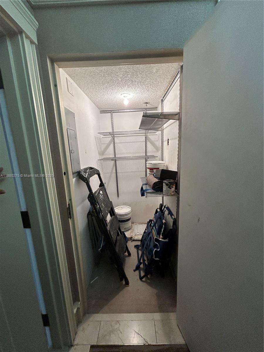 251 Crandon Boulevard, Unit 424 Key Biscayne, FL 33149 - Photo 22 of 22 a view of a hallway with workspace