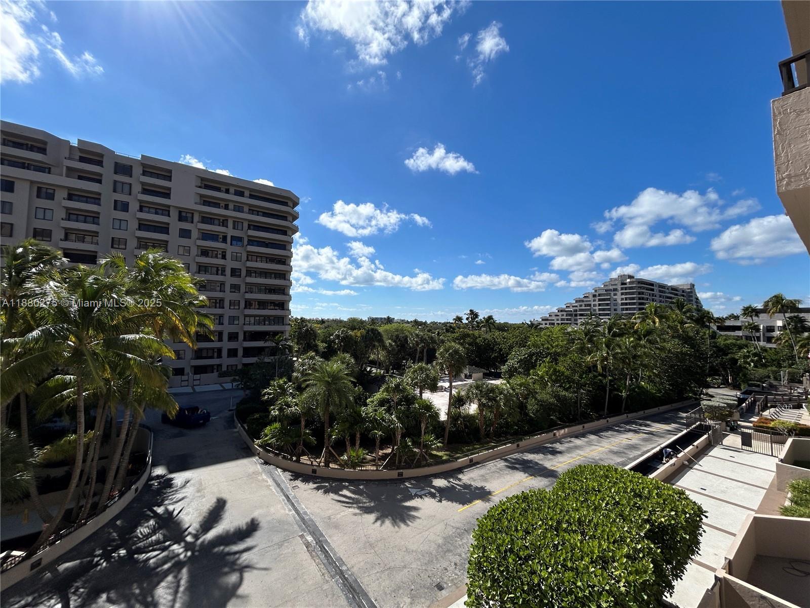 251 Crandon Boulevard, Unit 424 Key Biscayne, FL 33149 - Photo 3 of 22 a view of a pathway both side of building