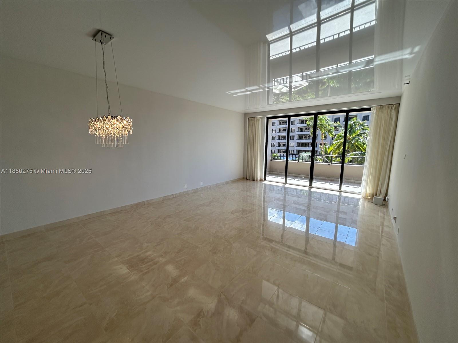 251 Crandon Boulevard, Unit 424 Key Biscayne, FL 33149 - Photo 8 of 22 a view of an empty room with a window