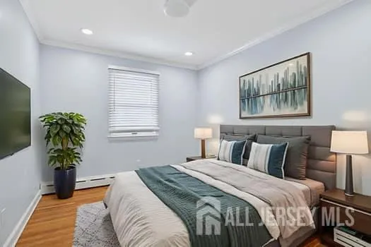 a bedroom with bed and a potted plant