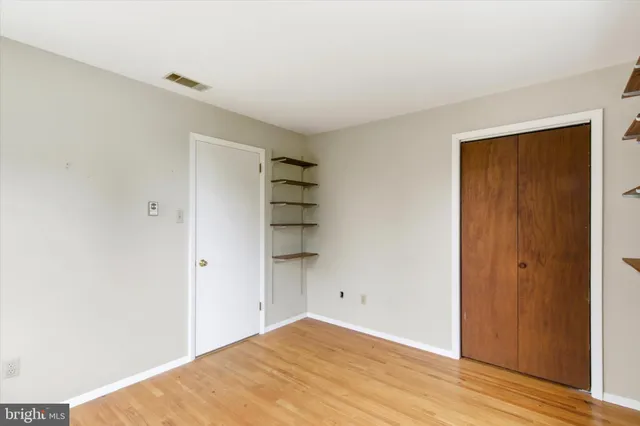 a view of a small space with wooden floor