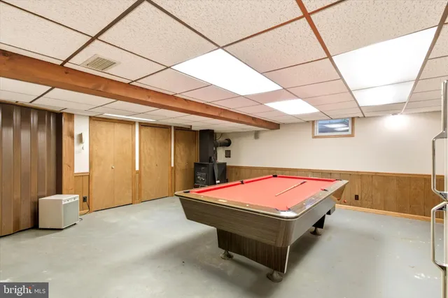 a room with furniture and pool table