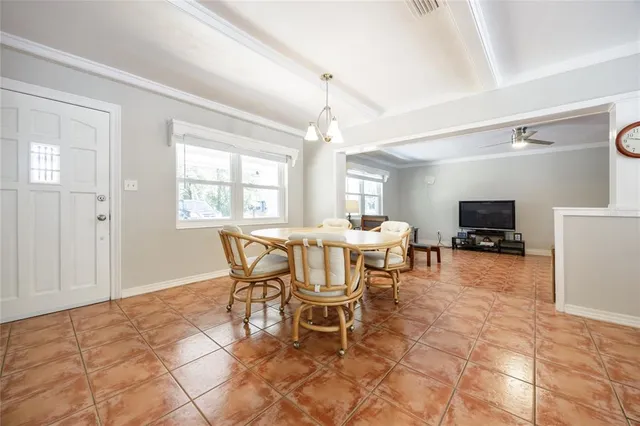a dining room with furniture and window