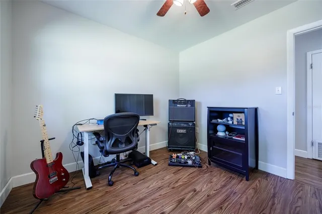a view of workspace with wooden floor lounge chair