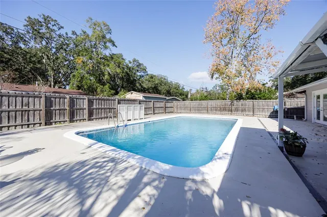 a view of a swimming pool with a patio
