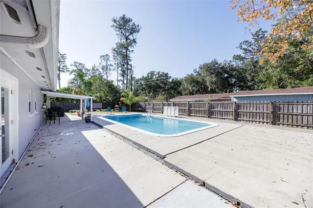 a view of a swimming pool with a patio