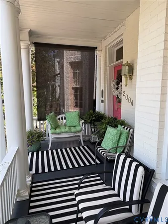 a view of balcony with a potted plant