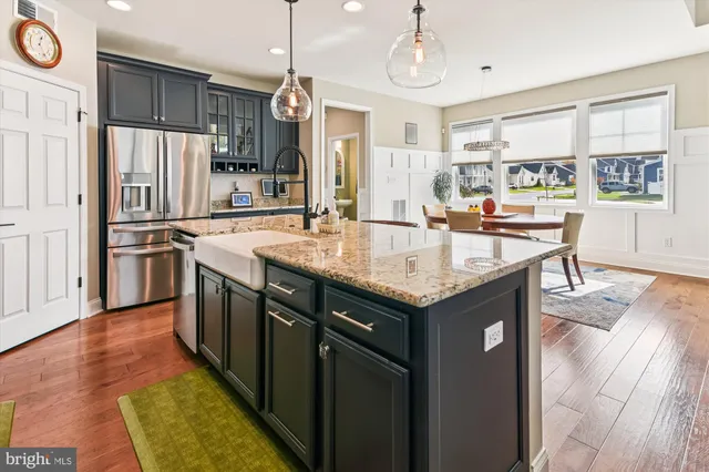 a dining table and chairs in a room