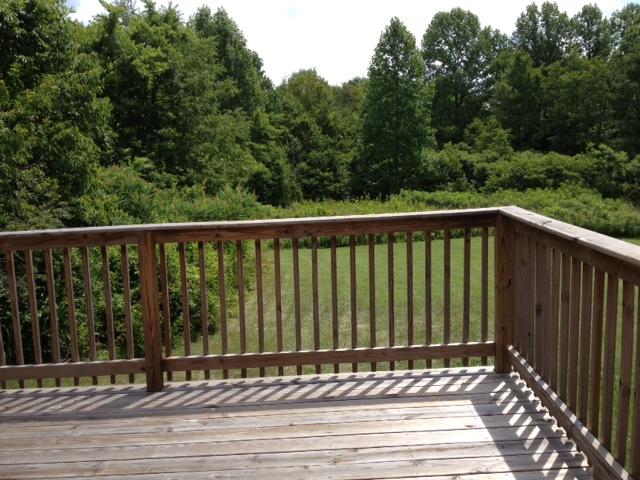 3696 Bowker Road Charlotte, TN 37036 - Photo 15 of 18 Brand new large deck off the back. Sit and enjoy your coffee while watching the birds,deer & turkey. Stop and LISTEN....Relax. No sirens. No cars honking.No hustle and Bustle. Small community of Charlotte is friendly and safe. Come on down!