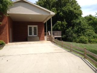 3696 Bowker Road Charlotte, TN 37036 - Photo 17 of 18 Side of the home. Note the new deck to the back. Concrete drive is very large. Also has another concrete drive at the other side of the home. This home has every detail taken care of for the new owner. It even has an old well on the property.