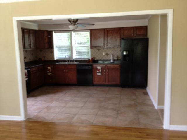 3696 Bowker Road Charlotte, TN 37036 - Photo 5 of 18 This wonderful kitchen is wide open to the living area for easy entertaining. Note the custom tile back splash, decorative open shelve, faucett,cool fan, tile flooring. Even has a built in over the stove microwave. No shortcuts here.
