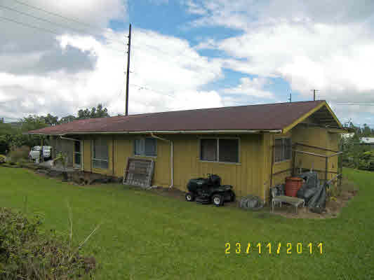 1785 Uhaloa Road Hilo, HI 96720 - Photo 3 of 12 a backyard of a house with table and chairs