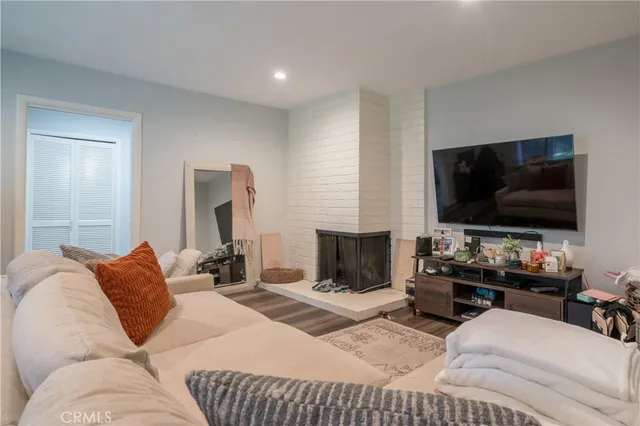 a bedroom with furniture and a flat screen tv