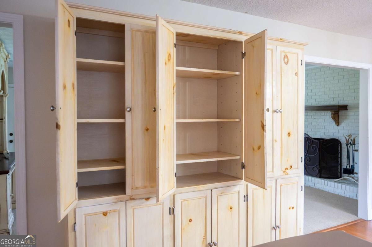 371 Burketts Ferry Road Hazlehurst, GA 31539 - Photo 18 of 53 a view of walk in closet with wooden floor