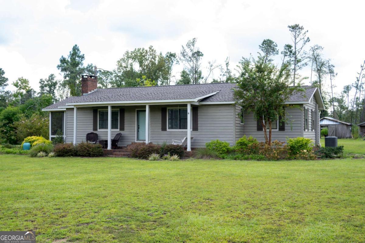 371 Burketts Ferry Road Hazlehurst, GA 31539 - Photo 2 of 53 a view of a house with a yard