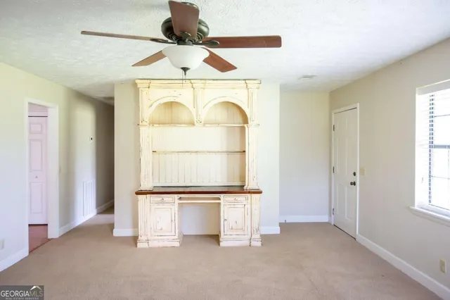 a view of gallery with wooden floor