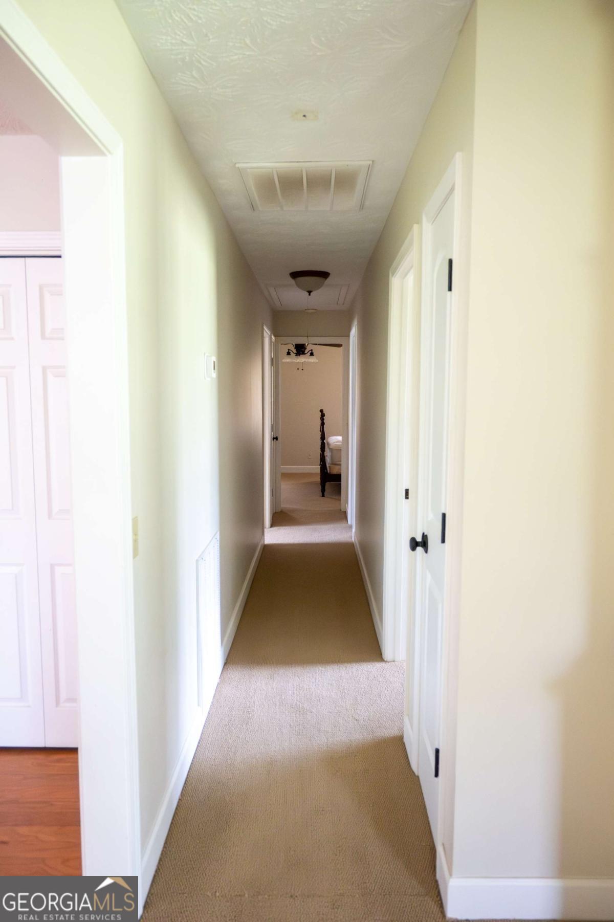 371 Burketts Ferry Road Hazlehurst, GA 31539 - Photo 24 of 53 a view of gallery with wooden floor