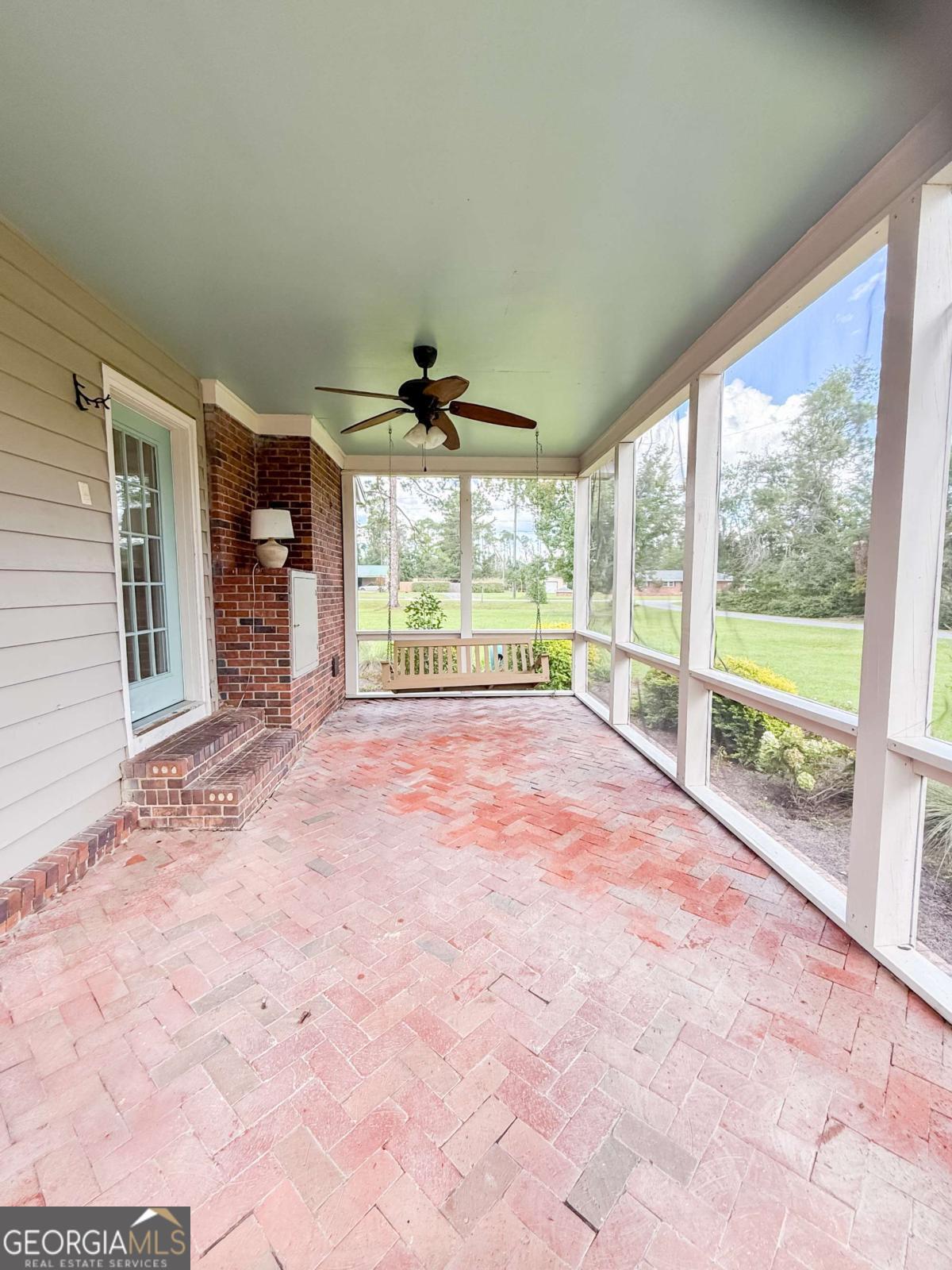 371 Burketts Ferry Road Hazlehurst, GA 31539 - Photo 25 of 53 a view of an empty room with a fireplace and a large window