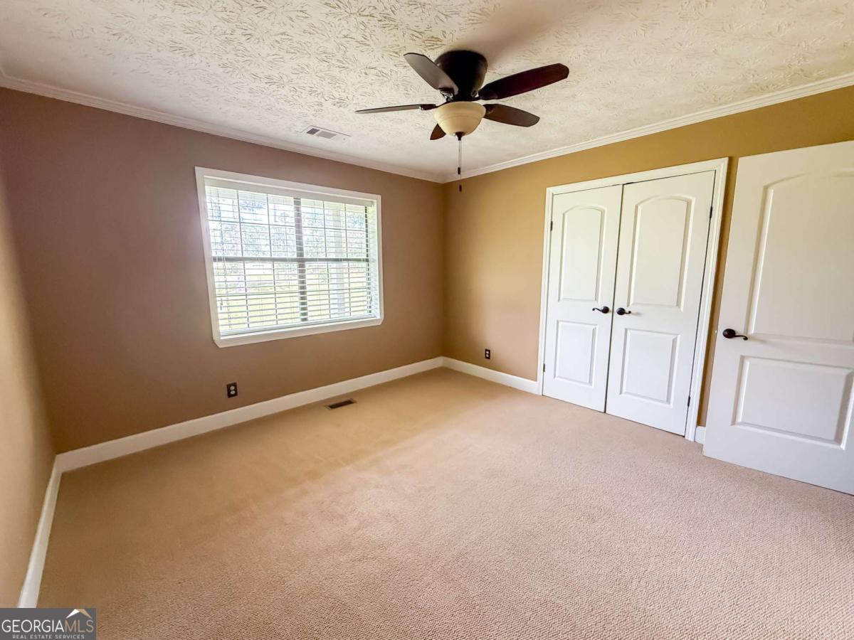 371 Burketts Ferry Road Hazlehurst, GA 31539 - Photo 33 of 53 a view of an empty room with a window
