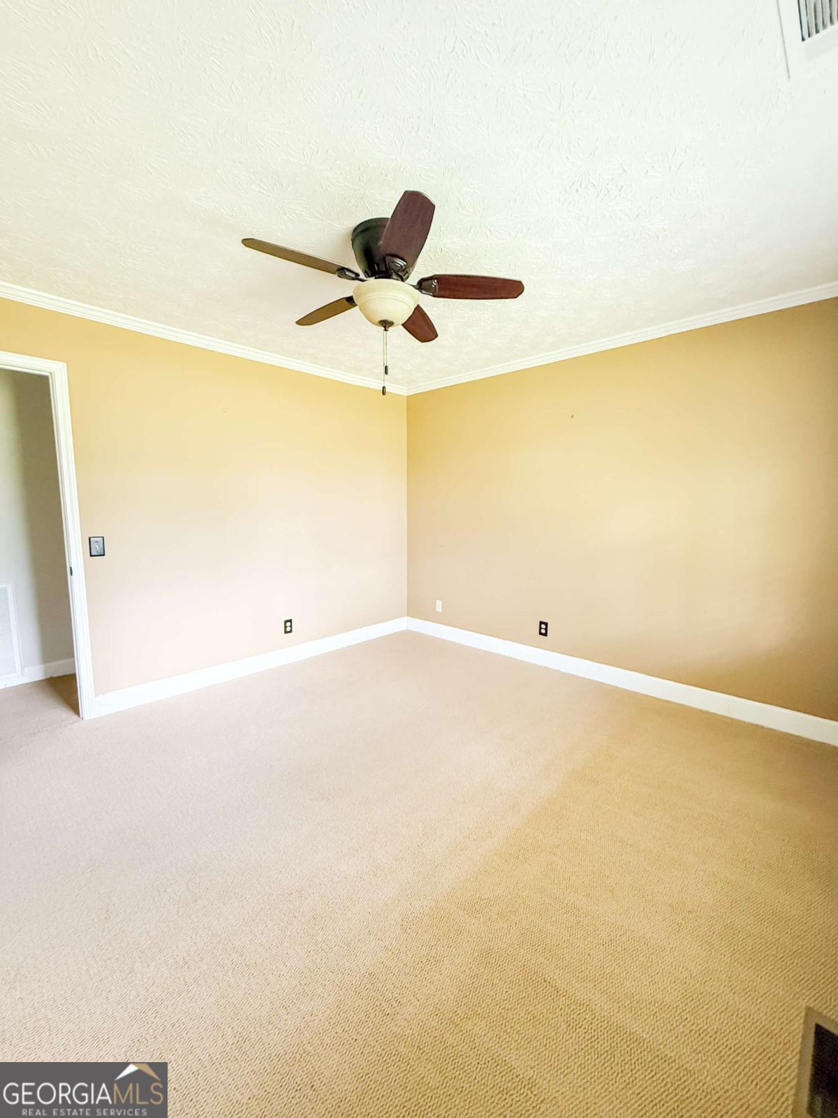 371 Burketts Ferry Road Hazlehurst, GA 31539 - Photo 35 of 53 a view of a big room with wooden floor