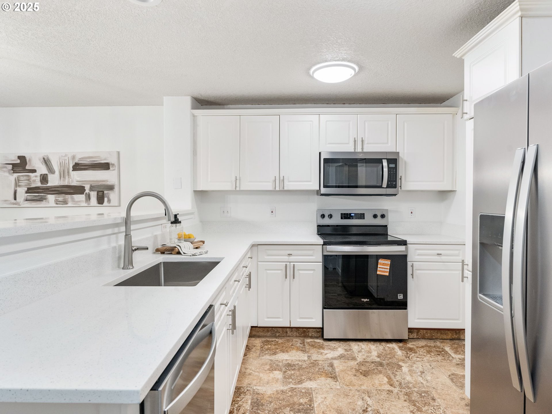 20744 Southwest Bingo Lane Beaverton, OR 97006 - Photo 12 of 26 a kitchen with a sink appliances and cabinets