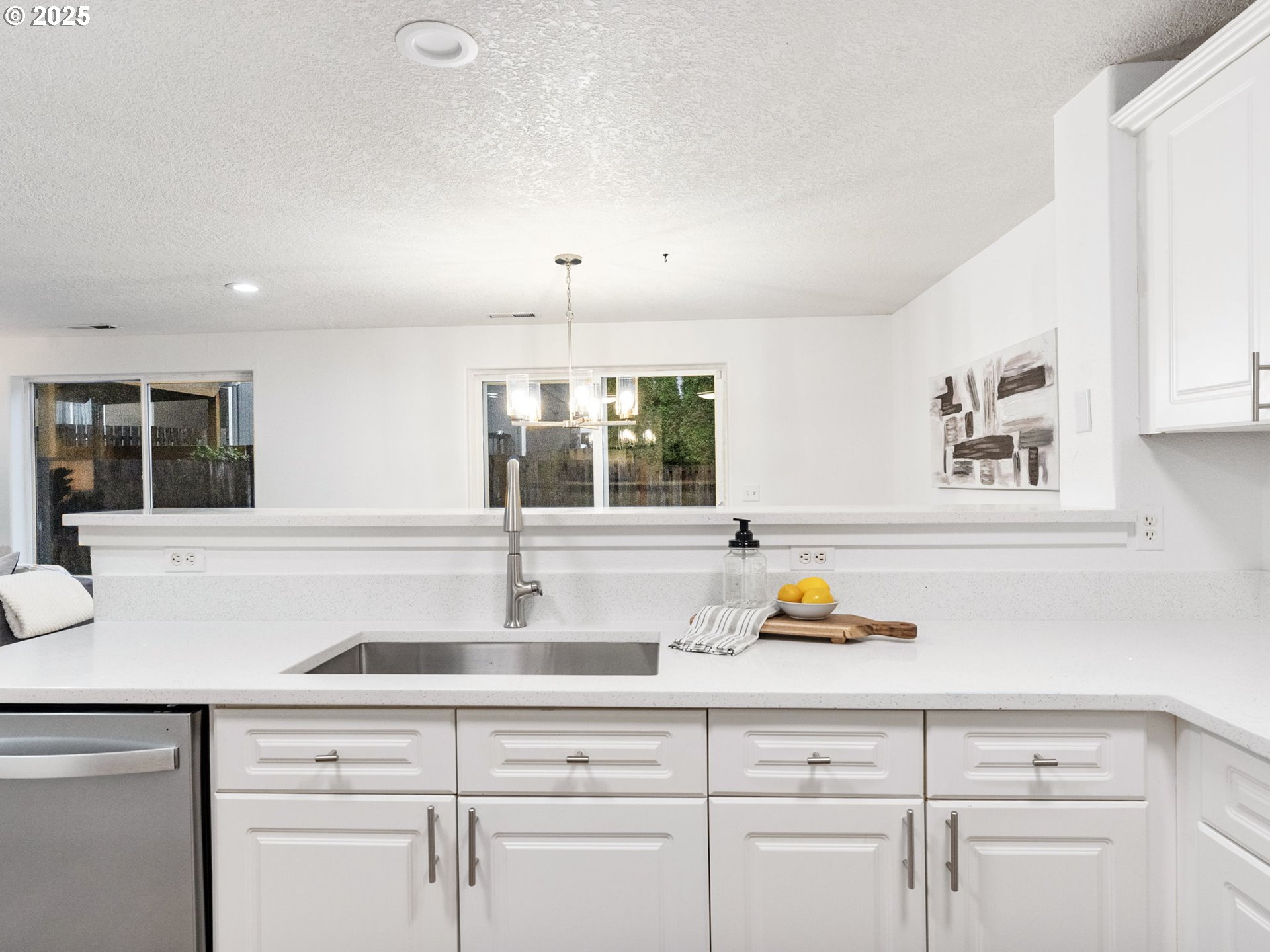 20744 Southwest Bingo Lane Beaverton, OR 97006 - Photo 13 of 26 a kitchen with a sink and cabinets