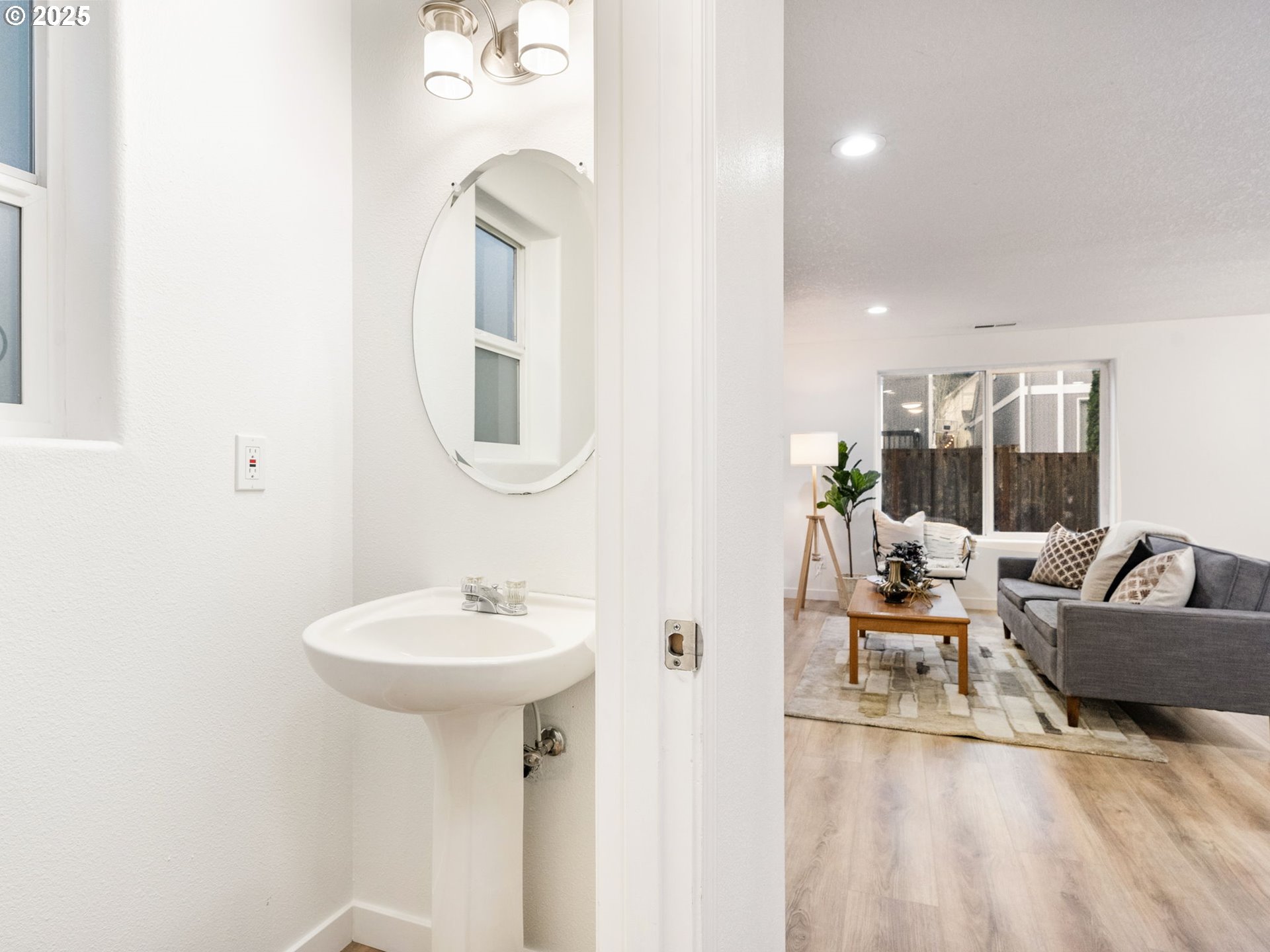 20744 Southwest Bingo Lane Beaverton, OR 97006 - Photo 14 of 26 a living room with furniture a lamp and a potted plant