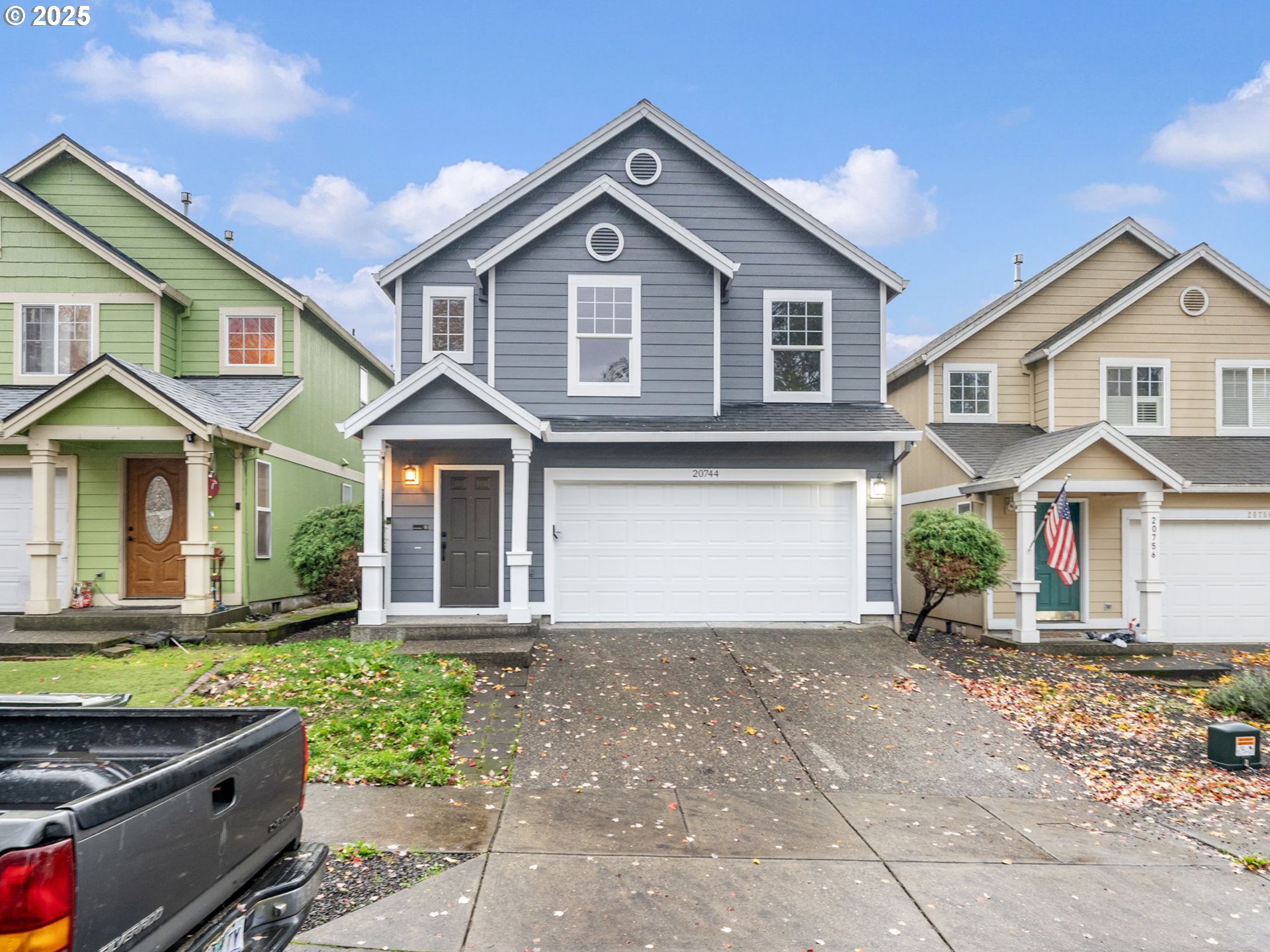 20744 Southwest Bingo Lane Beaverton, OR 97006 - Photo 2 of 26 a front view of a house with a yard and garage